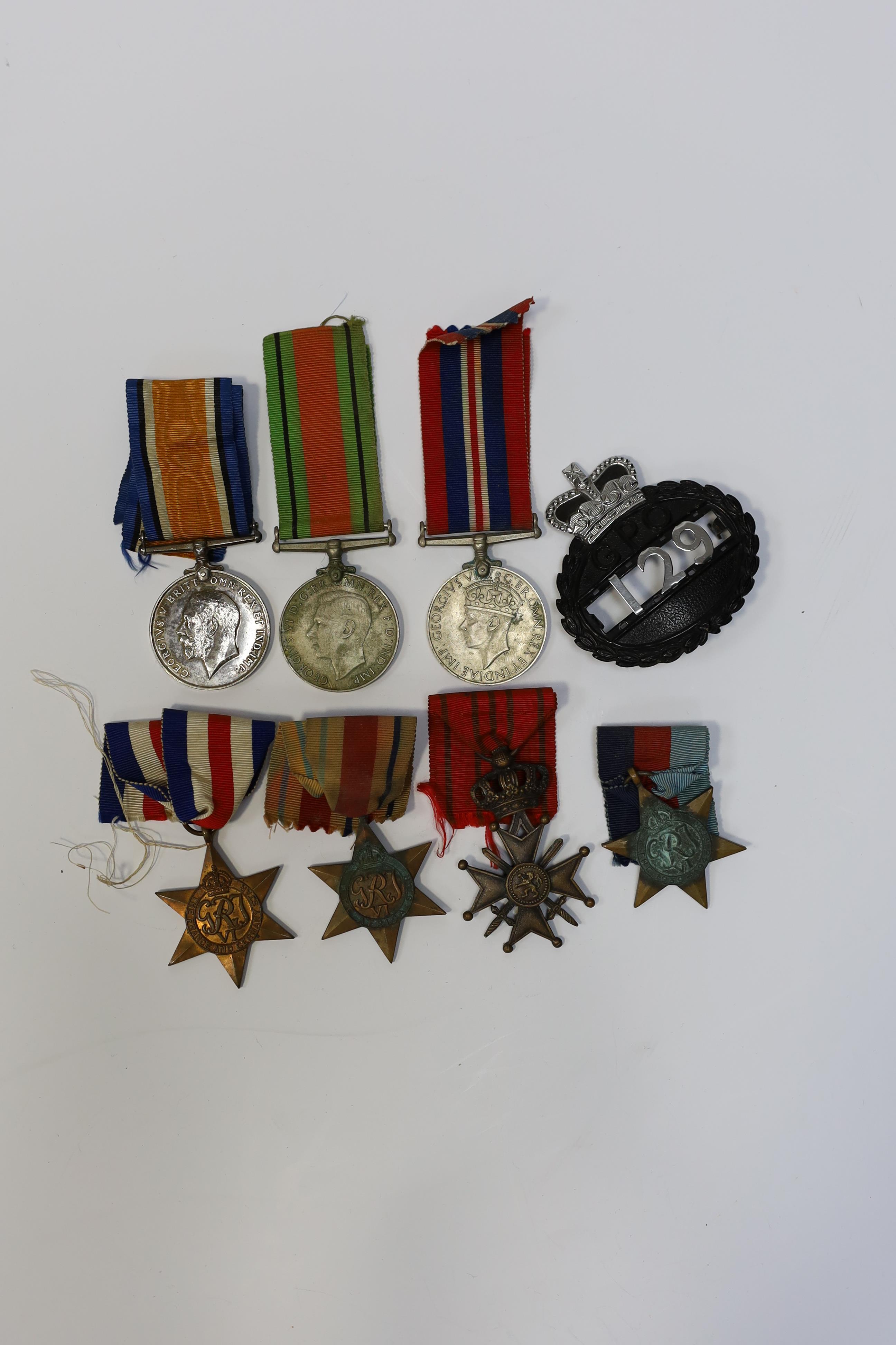 Seven medals including; a First World War British War Medal awarded to PTE. H. Lee DURH. L.I., A 1939-1945 medal, The Defence Medal, the Africa Star, the France and Germany Star, the 1939-1945 Star, plus a GPO cap badge.